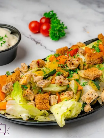 A fresh and crisp Classic Chicken Caesar Salad. It features grilled chicken, crisp lettuce, crunchy croutons, and my signature creamy dressing, making for a light yet satisfying meal option.