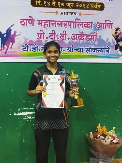 Swara Jangade with her trophy after securing a second-place finish in the U-15 Girls category at the 2nd District Ranking tournament.