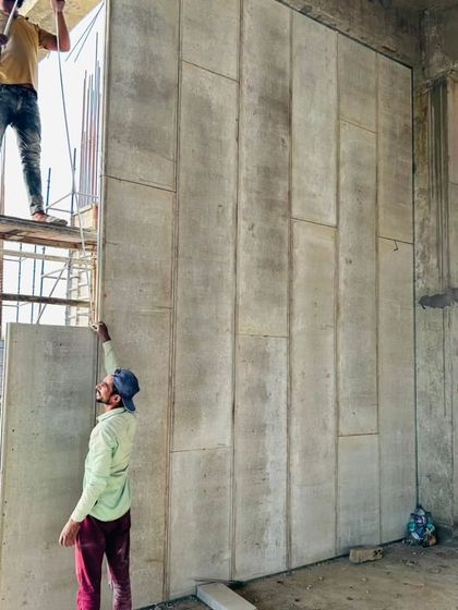 Our team carefully installs large Aerocon panels. This material is versatile and can be used for partitions and walls in homes, offices, factories, and our terrace rooms.