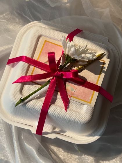 Various examples of my gift wrapping, showing different combinations of ribbons, flowers, and bags to suit any occasion.