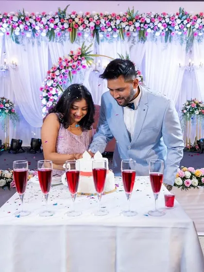 The couple cutting their engagement cake together.
