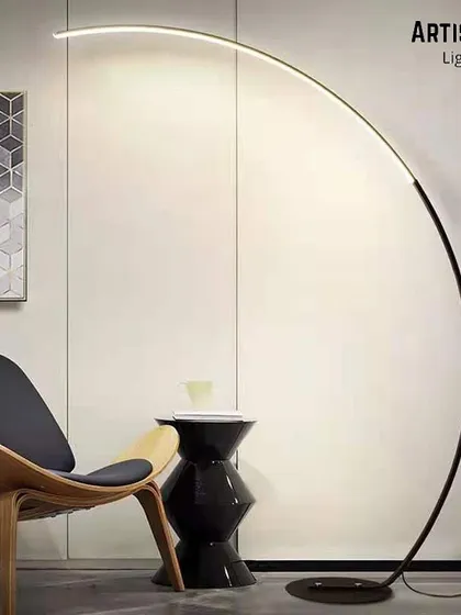 Embrace the beauty of minimalism with our modern arc floor lamp. Its sleek, sweeping curve provides overhead lighting with grace and simplicity, making it a perfect addition over a sofa or reading chair for a touch of contemporary elegance.