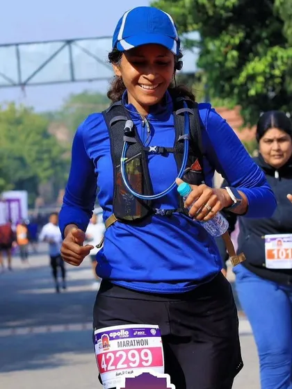Ambika in her element during a marathon. We provide ongoing support for endurance athletes, helping them manage the physical demands of training and racing to prevent injury and achieve their goals.