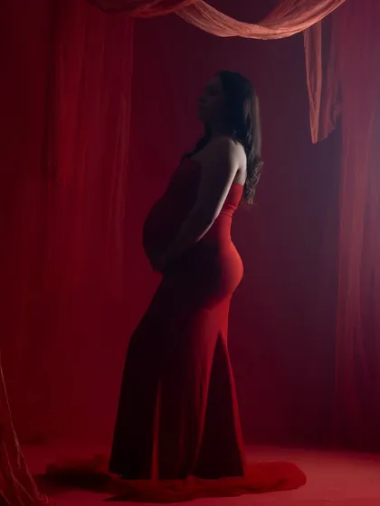 Another silhouette from the red-themed shoot, capturing a different angle and playing with light and shadow.