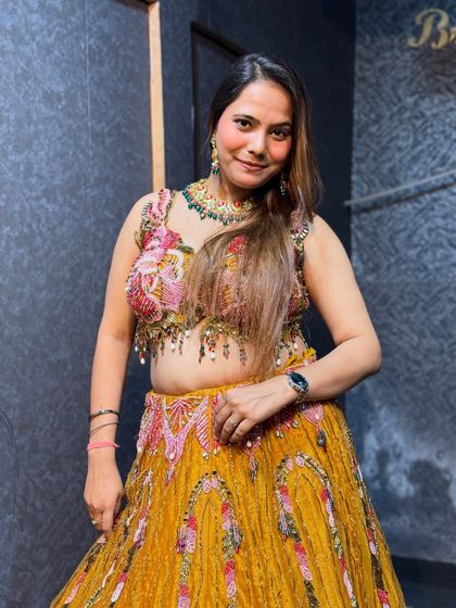 A happy client in her Haldi lehenga. The matching jewelry completes the look perfectly.