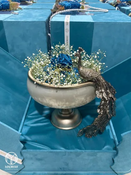 Another view of the Peacock Bowl hamper in its blue velvet box. The presentation is as important as the gift itself, and I ensure every detail, from the ribbon to the lining, is perfect.