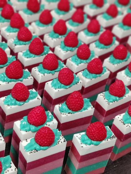 A fresh batch of my popular Strawberry soaps, remade for the nth time! The layers, piped topping, and little strawberry embed make this a customer favorite.