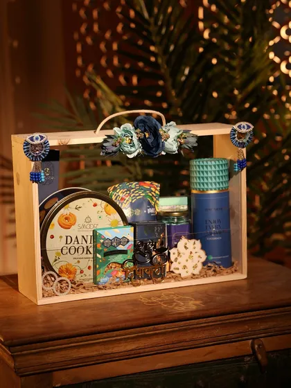 This is one of my favorite premium Diwali hampers. Packed in a beautiful wooden crate with acrylic slides, it includes gourmet cookies, sweets, and elegant decor items, perfect for making a lasting impression on clients or employees.