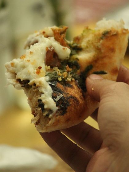 The best way to enjoy a freshly baked flatbread with potato parmesan espuma. This shows the delicious end result of the baking process.