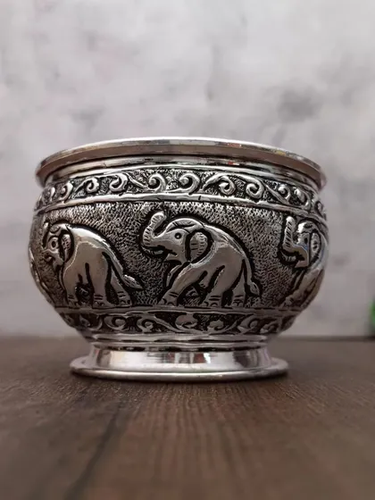 A different angle of the antique elephant designer bowl, showing its depth and the quality of the carving.