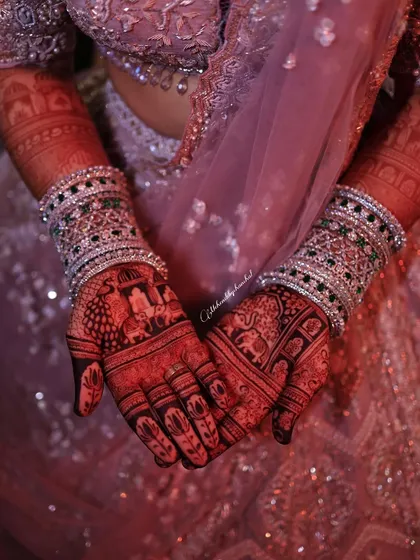 The magic is in the stain. This is the beautiful, deep reddish-brown color you can expect from my all-natural henna paste after it develops. It looks so stunning against the bridal lehenga.