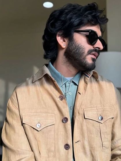 A profile view of Harshvarrdhan Kapoor's casual yet polished hairstyle, perfect for a day of press events.