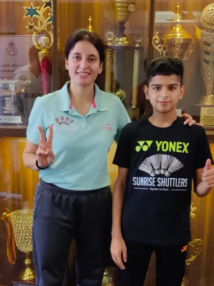 **Coach and Student: A Winning Combination.** High-Performance Director Kusumm Singh with her student Vedant Pahwa. This photo captures the mentorship that is central to our academy's philosophy.