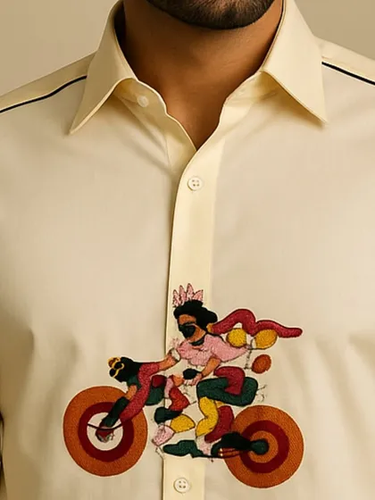 An extreme close-up of the cyclist embroidery, showing the texture and variety of colors used. This is the kind of detail that makes each shirt a one-of-a-kind piece.