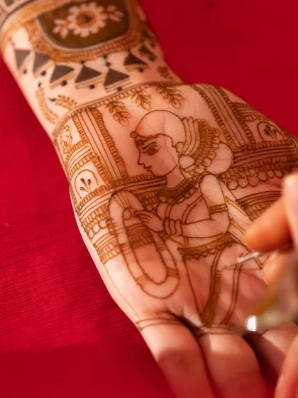 The process of creating a custom bride portrait. Every line is carefully drawn to capture the likeness and grace of the bride, turning her hand into a canvas for her own story.