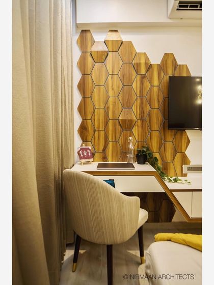 A smart daughter's bedroom with a unique hexagonal wood-paneled wall behind the study desk. The design is modern, functional, and incorporates home automation for lighting and entertainment.