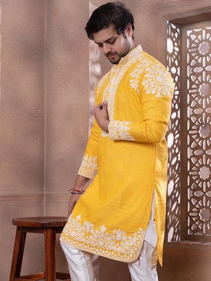 A three-quarter view of the zesty yellow kurta, a bright and cheerful option for a Haldi or Mehendi.