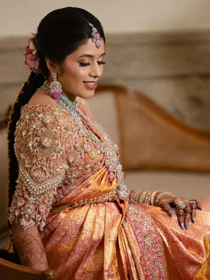 A closer look at the magic of hand embroidery. This peach-toned blouse is covered in intricate 3D flowers and beadwork, a signature style that brings texture, dimension, and a touch of modern romance to any bridal look.