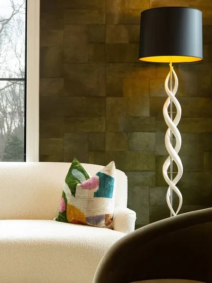 Draped in our Appaloosa wallpaper, this lounge pulses with bold color and a playful sense of sophistication. The unique texture adds striking contrast to a home of otherwise quiet, monochrome design.