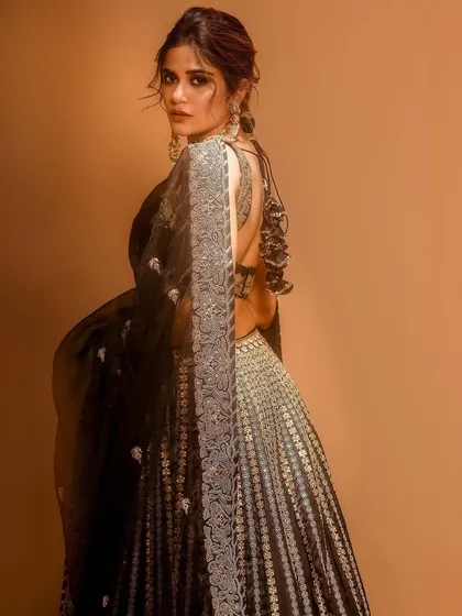 A look of effortless elegance for Aaditi Pohankar. The makeup is soft yet defined, paired with an intricate traditional outfit and a beautifully styled updo, creating a timeless and graceful appearance.