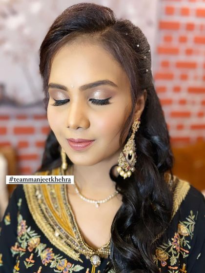A soft and subtle glitter eye for a client attending her daughter's naming ceremony. This is a great example of a sophisticated and pretty party makeup look.