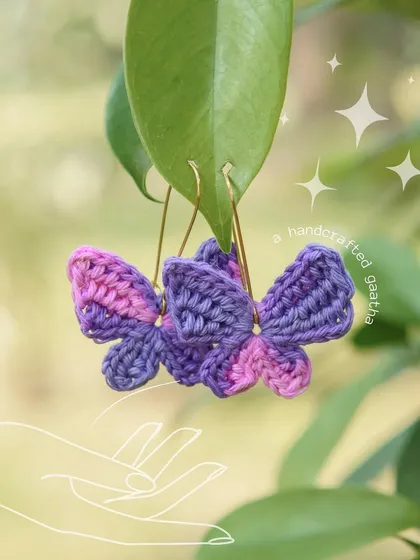 Another beautiful shot of the pink and purple butterfly earrings, sparkling in the light.