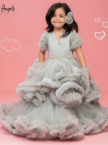 The Luna Grey gown is all about dramatic texture, with layers of structured and soft ruffles creating incredible volume.