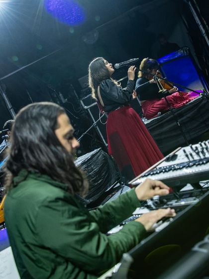 A view from the keyboardist's perspective at the Jazz Al Parque festival. It shows the scale of the stage and the intricate setup required for our world fusion music performance.