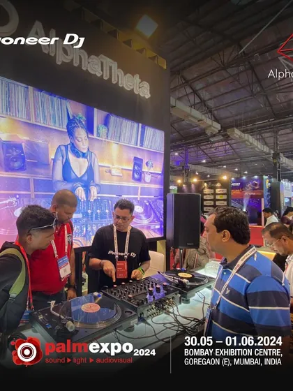 Demonstrating a vinyl setup at the Palm Expo. It's important to understand the roots of DJing, even as we embrace new digital tools.