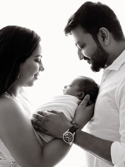 The same classic pose in black and white, which adds a timeless and artistic quality to the family portrait.