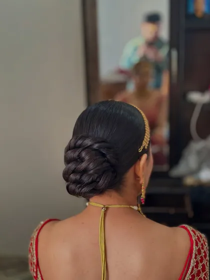 A side profile of the clean twisted bun, showing how it sits elegantly at the nape of the neck.