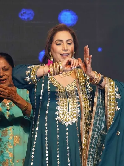 A beautiful moment of a family member performing a traditional dance step. We teach graceful hand gestures and expressions to make every performance authentic.