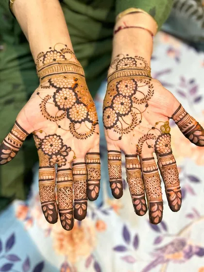This beautiful floral design features bold flower outlines with delicate shading inside. The flowing pattern creates a sense of movement, making it a graceful choice for any occasion.