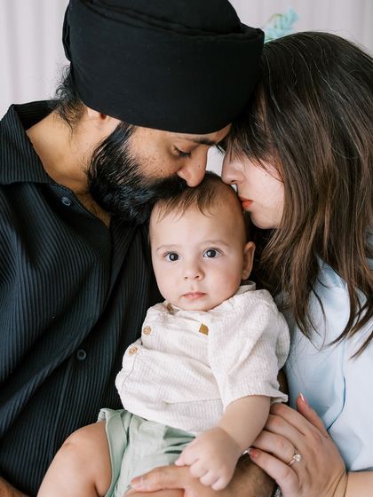 A family portrait from a seven-month-old's milestone shoot. It's a joy to capture their growth and changing personalities.