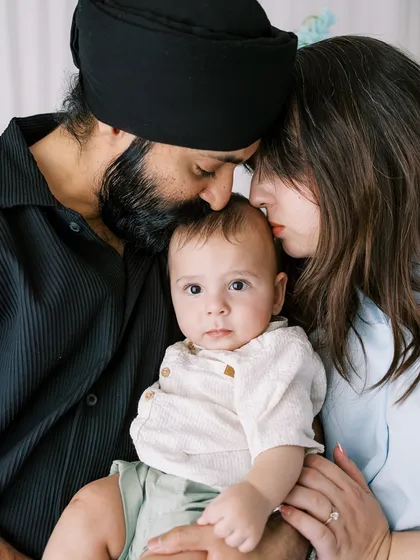 An intimate family moment, with parents cuddling their seven-month-old son. These are the memories that last a lifetime.