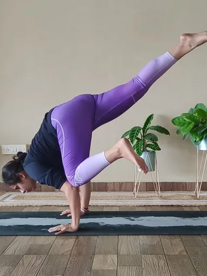 The One-Legged Crow Pose is an advanced arm balance that challenges your strength and focus. This student demonstrates incredible control and stability, showcasing the results of dedicated practice.