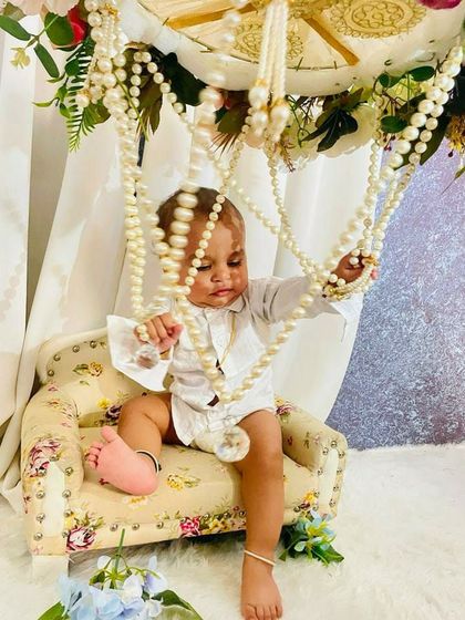 Explore our various floral and elegant setups. These sets feature props like swings, ornate chairs, and pearl decorations, all surrounded by beautiful flowers for a timeless and pretty photoshoot.