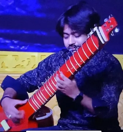 Playing my custom red electric Zitar on a beautifully lit stage. This instrument is a showstopper.