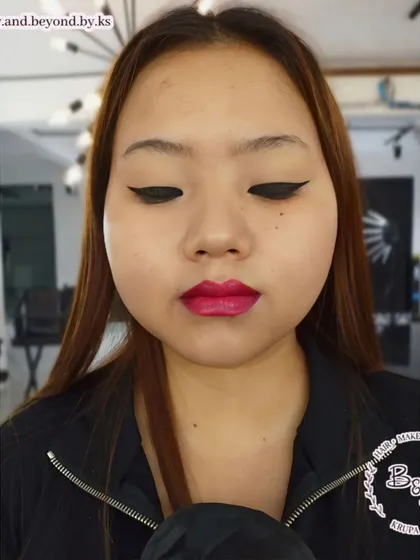 I believe makeup is for everyone and I'm experienced in working with all features, including monolid eyes. Here, I created a sharp, bold winged eyeliner and a defined lip to beautifully accentuate her features.