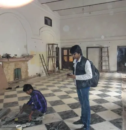 An early stage of the haveli restoration, with team members documenting the existing conditions. This project involved converting a historic residence into a contemporary home while preserving its unique character.