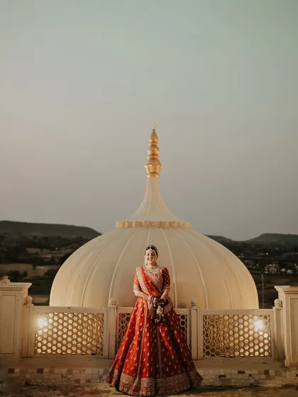 For me, a bridal portrait is about capturing the bride in her element. Here, I used the magnificent architecture of the destination as a backdrop, making the bride look regal and timeless against the twilight sky, a true queen in her palace.