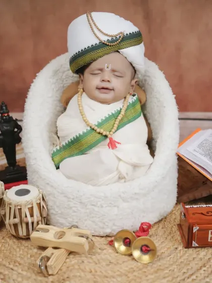 A sleeping newborn peacefully embodying the spirit of a Warkari pilgrim. This is a serene and powerful portrait for families to treasure.