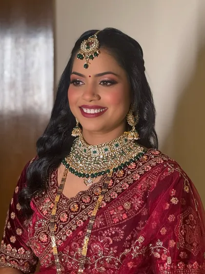 A smiling portrait of my royal bride. Her makeup is designed to last all night, ensuring she looks fresh and flawless from start to finish.