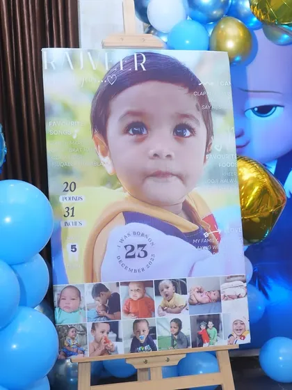 A custom milestone board for a Boss Baby-themed first birthday, showcasing the baby's photo and cute details. A wonderful keepsake for the parents.