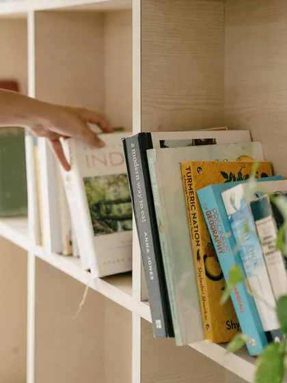 Reaching for a new read from our shelves. We have a curated selection of books on food, wellness, and fiction for you to enjoy.