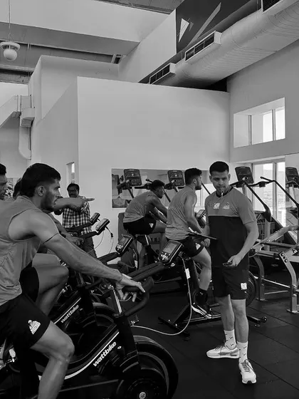 A black and white shot of a Wattbike conditioning session. The mood is focused as we build the endurance base for a long season.