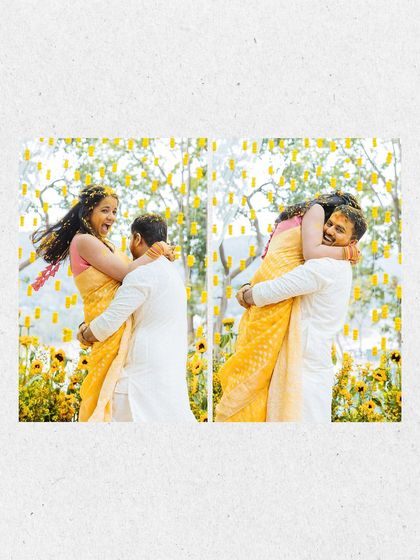 A playful, candid moment of the groom lifting the bride in his arms during their Haldi celebration.