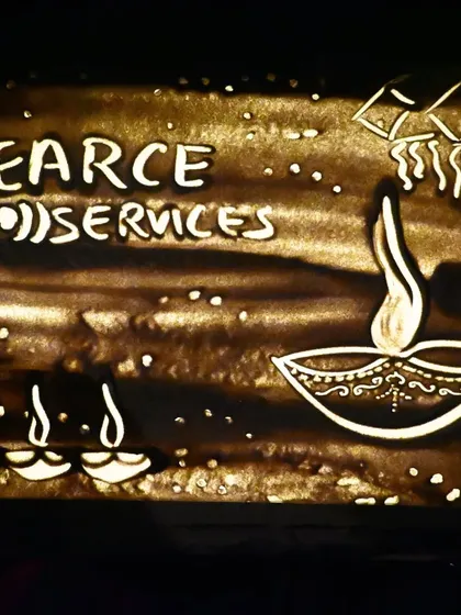 The final sand art frame from the Diwali Bash for Pearce Services. This image combines their corporate logo with traditional Indian festive symbols, creating a perfect visual for their holiday event.