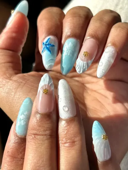 I brought the beach to my client's fingertips with this Goa-inspired set. It features 3D sculpted shells and starfish, sandy textures, and ocean-blue hues to capture those perfect vacation vibes.