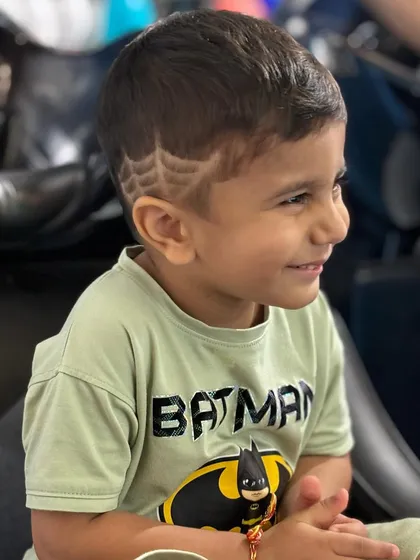 A close-up of the spider-web design, showing the precision and detail that goes into these fun hair tattoos.